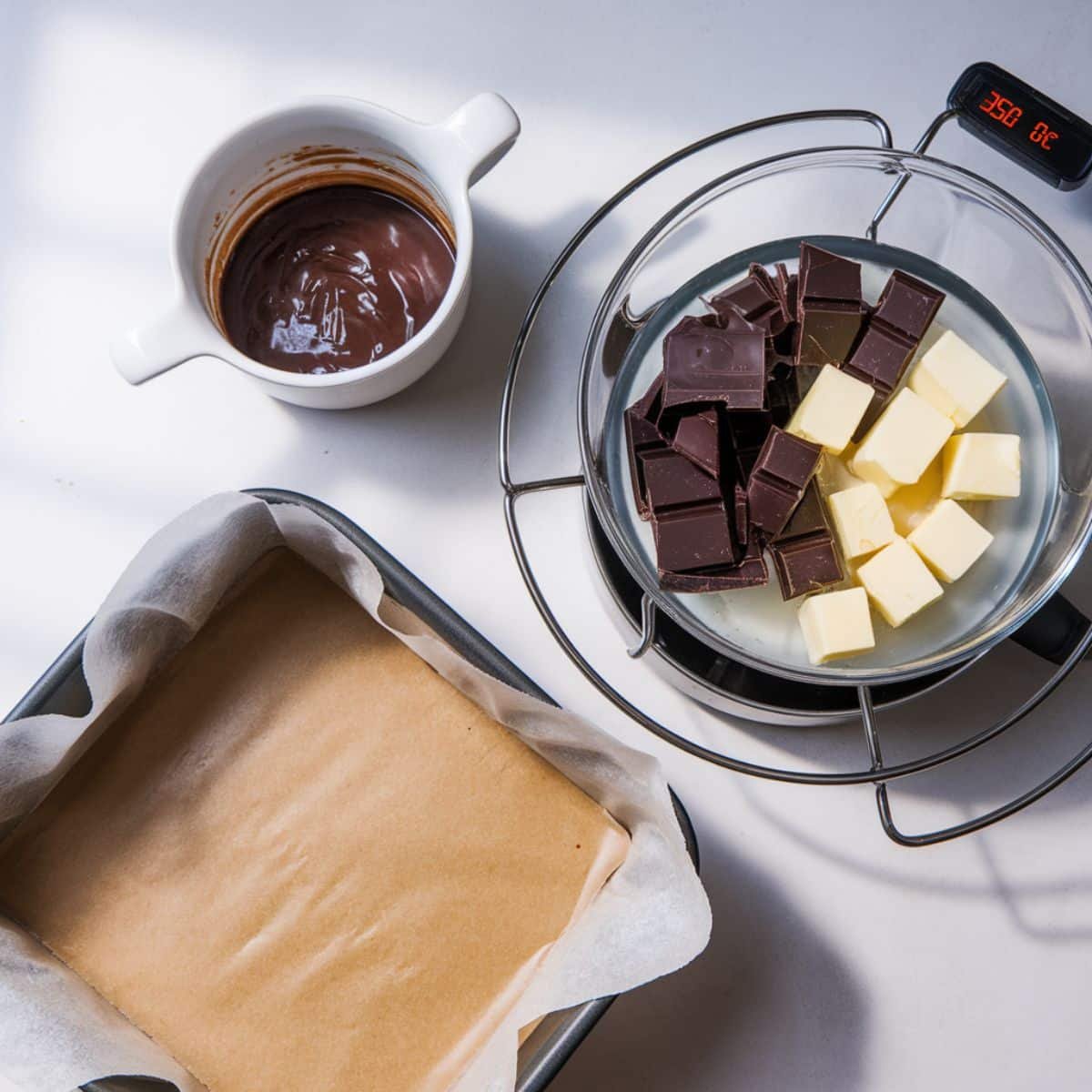 a baking pan with butter and chocolate in it