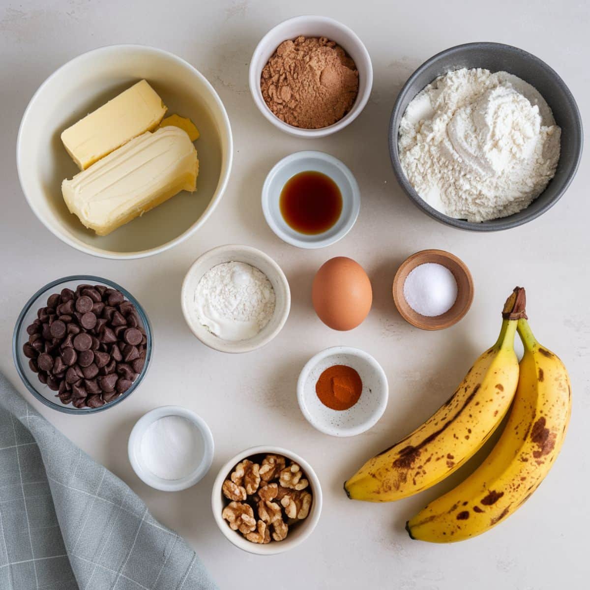 Banana cookie ingredients on a white counter	