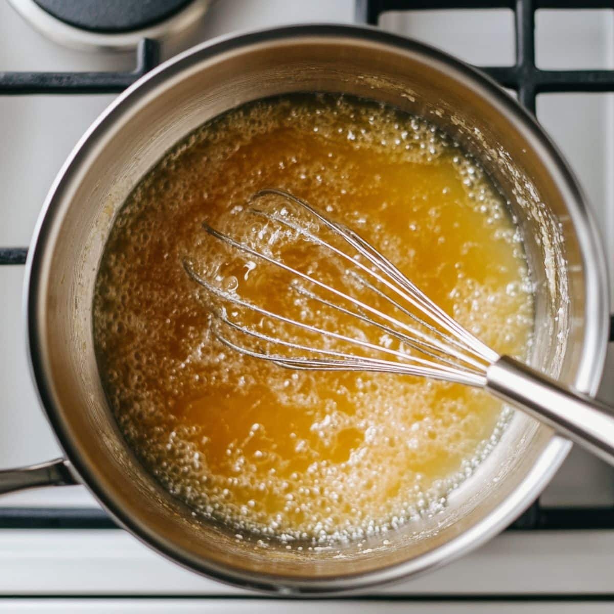 Whisking thick Turkish delight mixture in saucepan	