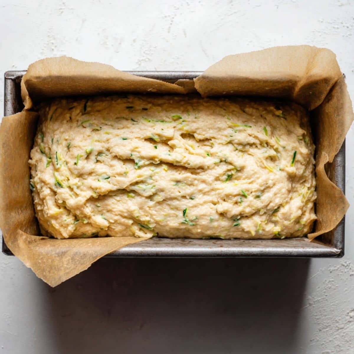 Batter resting in loaf pan before baking