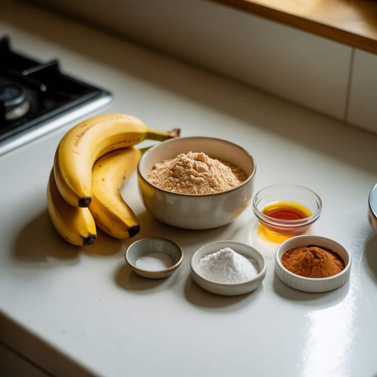Ingredients for almond flour banana pancakes including bananas, eggs, almond flour, and vanilla.	