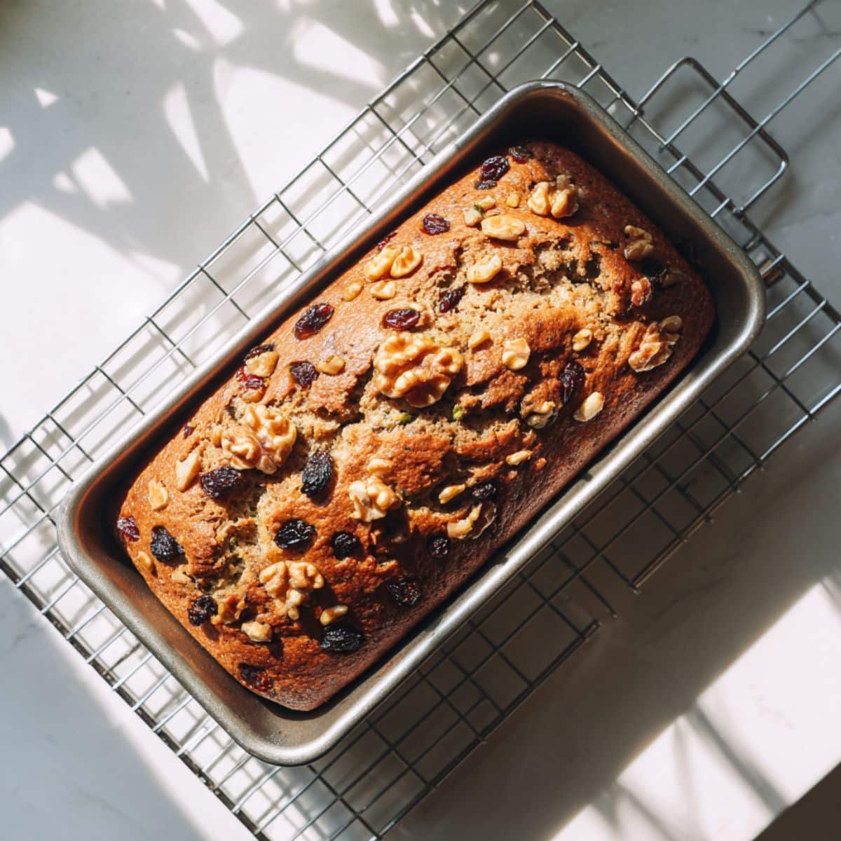 Freshly baked avocado bread cooling on a wire rack	