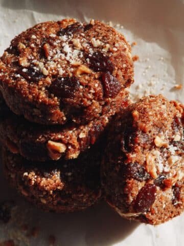 Stack of chewy homemade date cookies on a white countertop