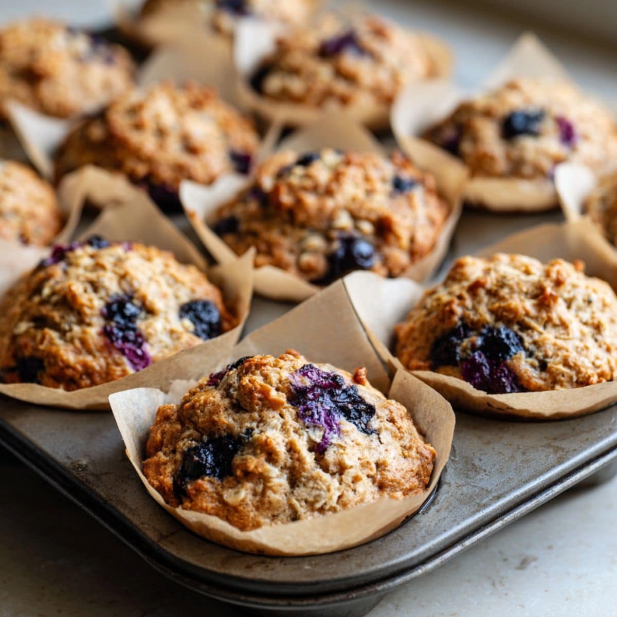 Banana blueberry muffins freshly baked in tin	