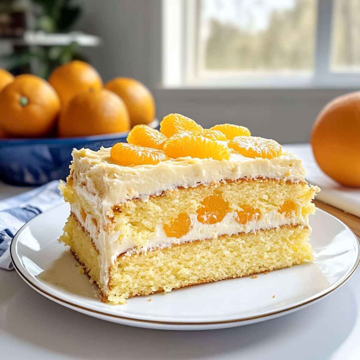A homemade pig pickin cake with whipped pineapple frosting and mandarin slices on top	