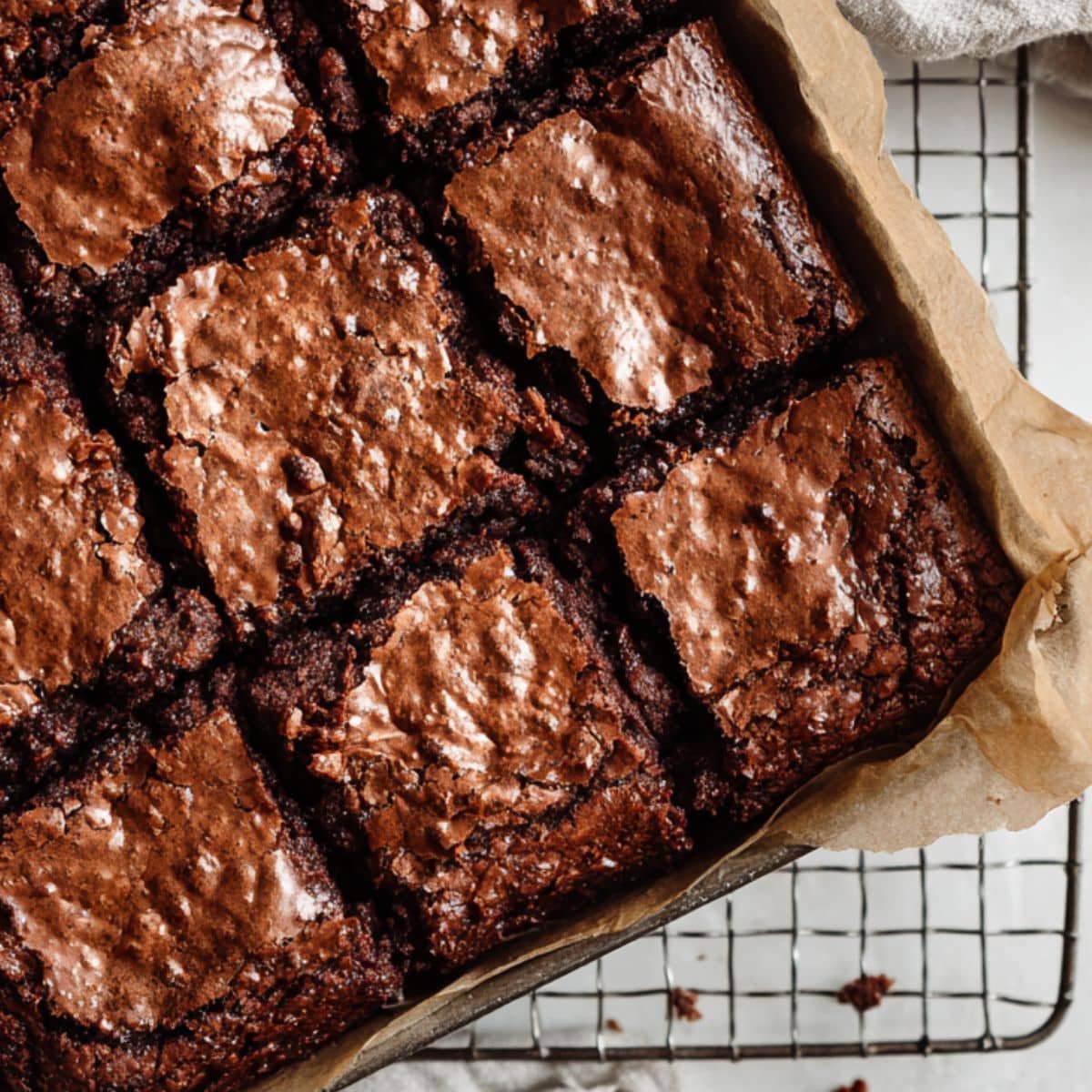 Baked Nutella brownies cooling in pan on a wire rack	