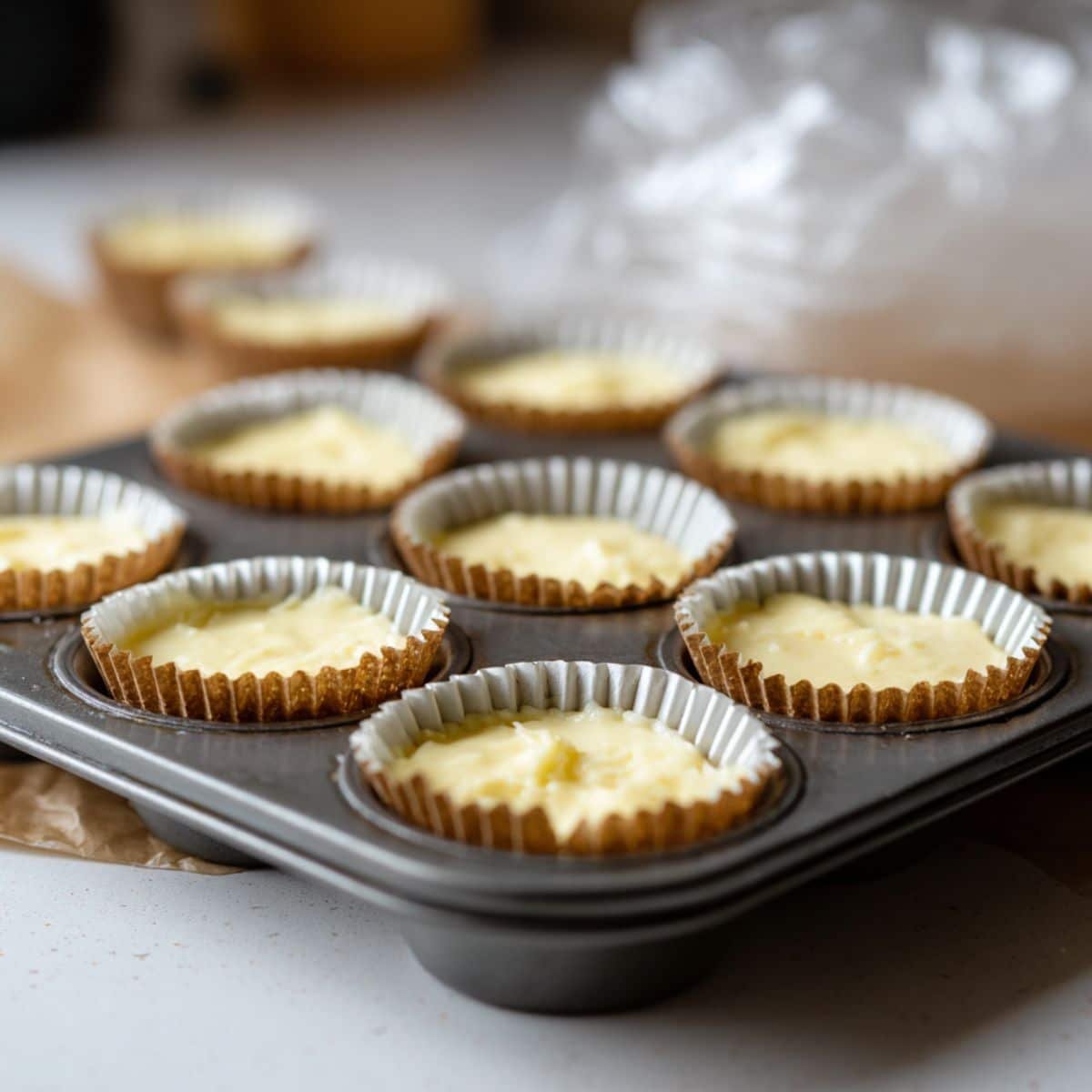 Mini cheesecake bites filled and ready to chill in the fridge	