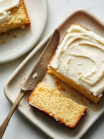 Homemade vanilla pudding cake sliced open, showing moist texture and creamy layer