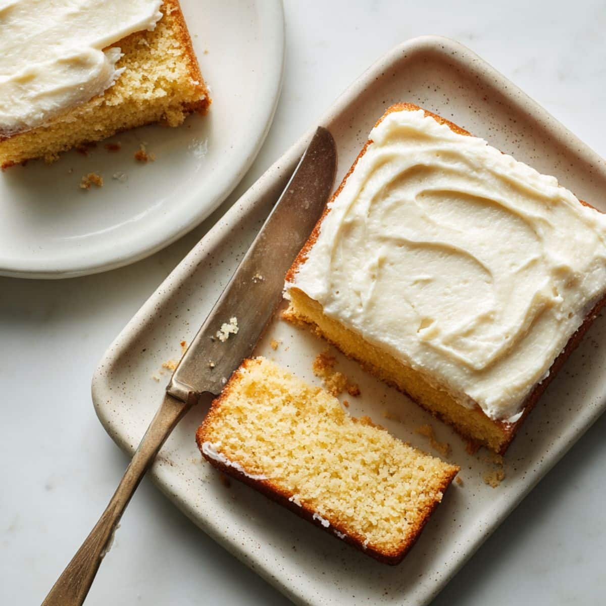 Homemade vanilla pudding cake sliced open, showing moist texture and creamy layer	