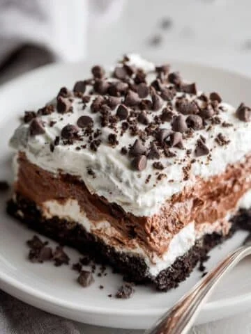 Chocolate lasagna slice on white plate