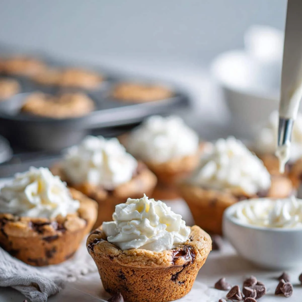 Cookie cups filled with swirled frosting and ready to serve	