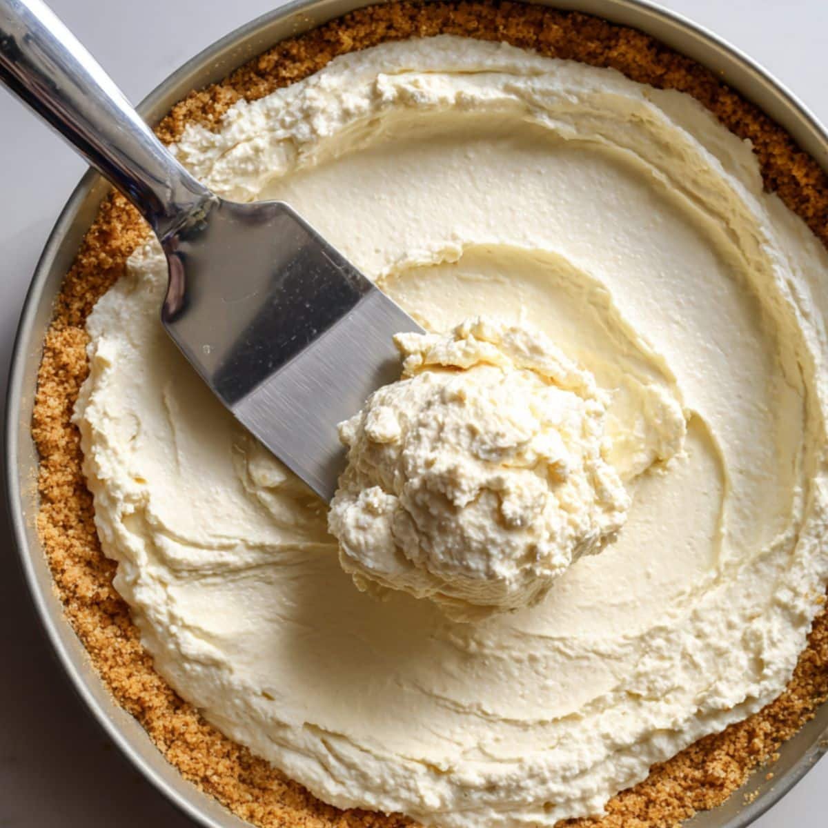 Spreading ricotta filling into crust before chilling	