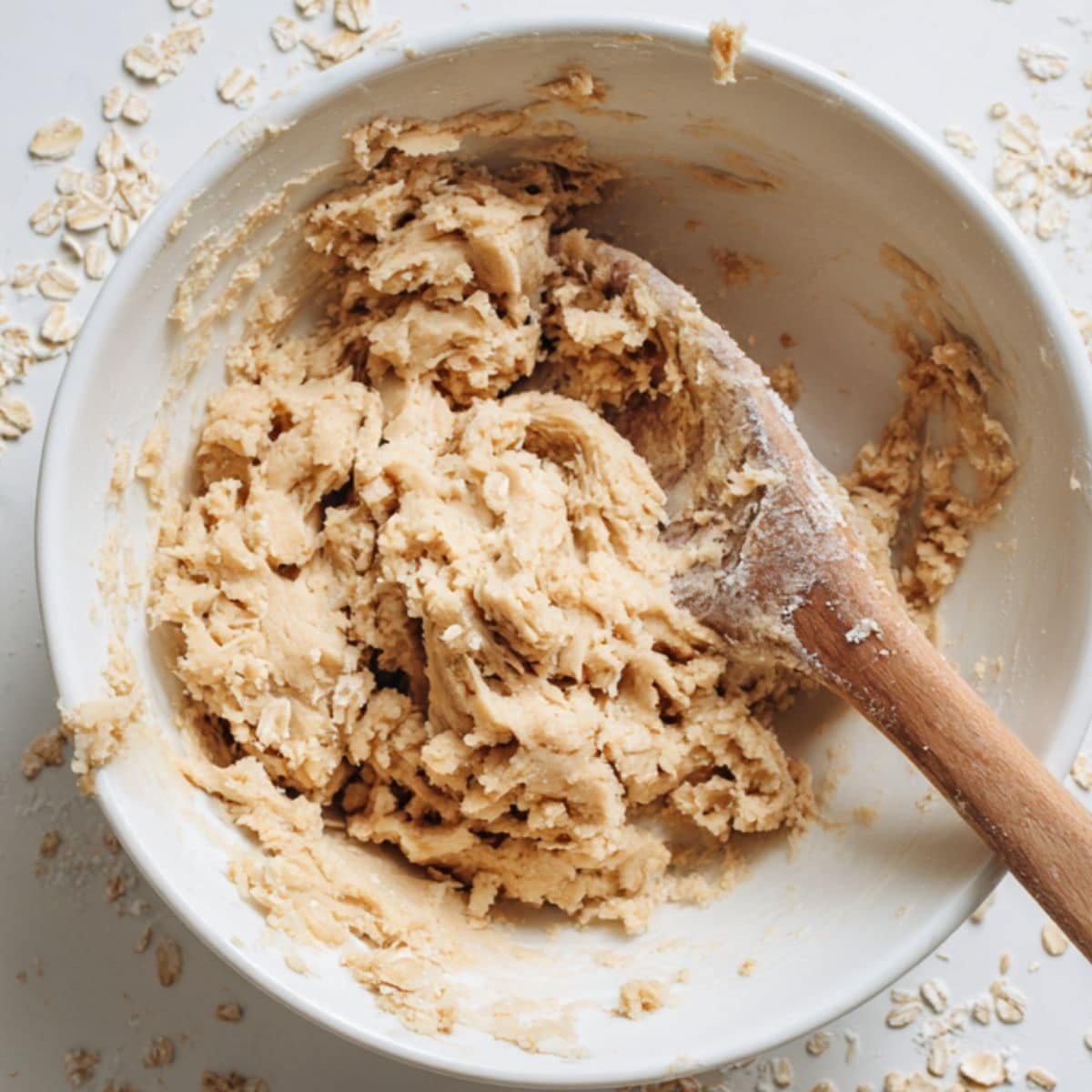 Homemade oatmeal cookie dough being mixed in a bowl