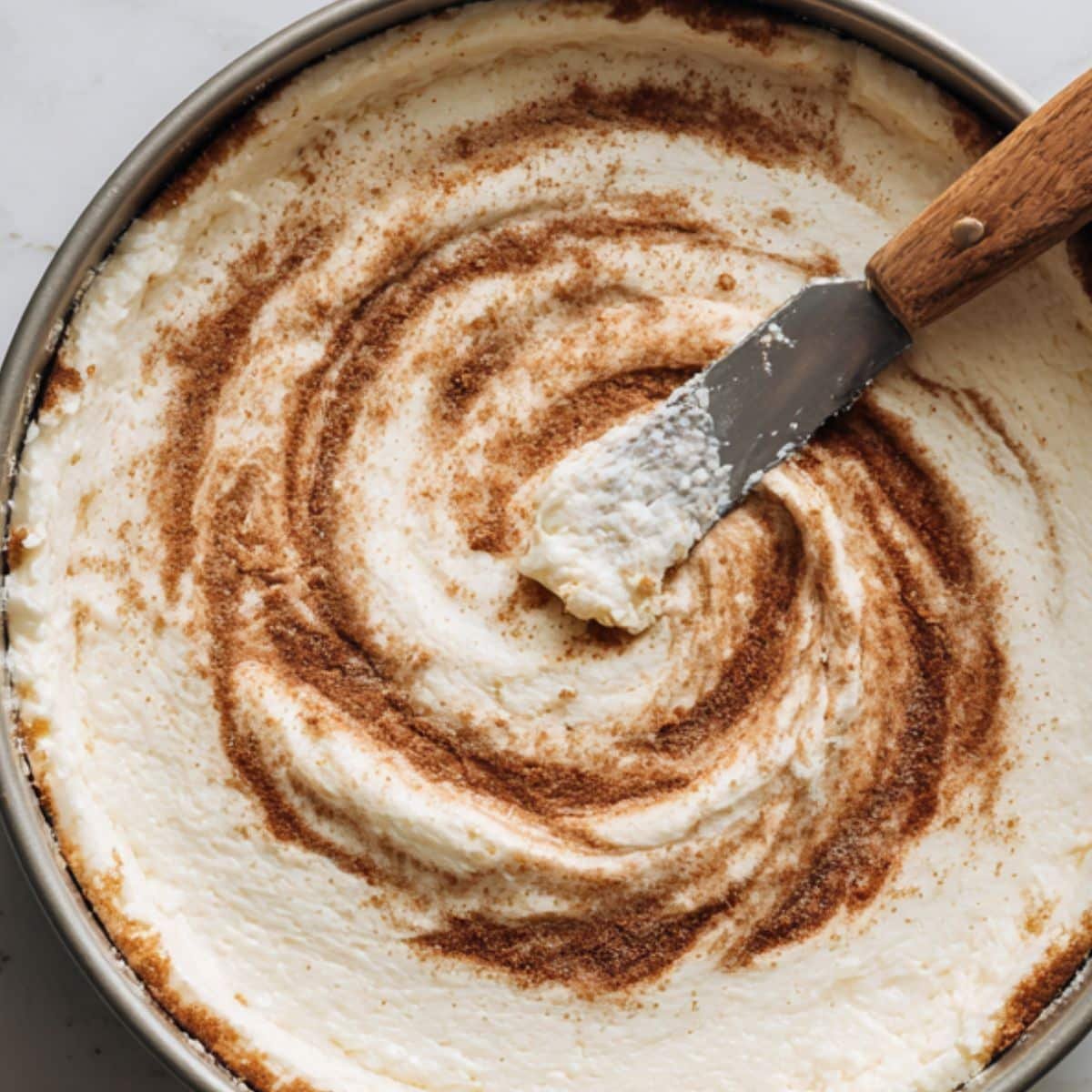 No bake cinnamon roll cheesecake swirled