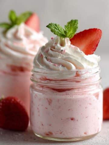 Creamy homemade strawberry mousse in jars