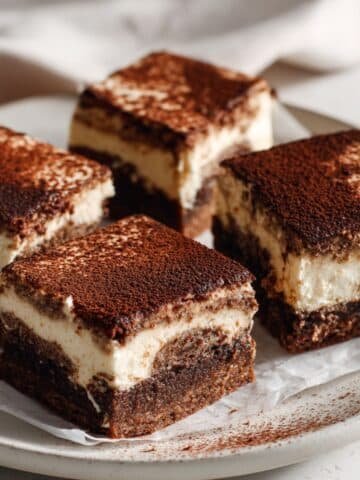 Fudgy tiramisu brownies with mascarpone topping and cocoa dust