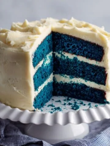 Three-layer blue velvet cake with cream cheese frosting