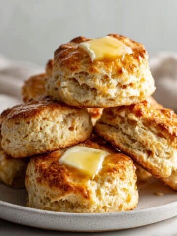 Fluffy golden Breakfast Biscuit Recipe cooling on a rack in a white kitchen