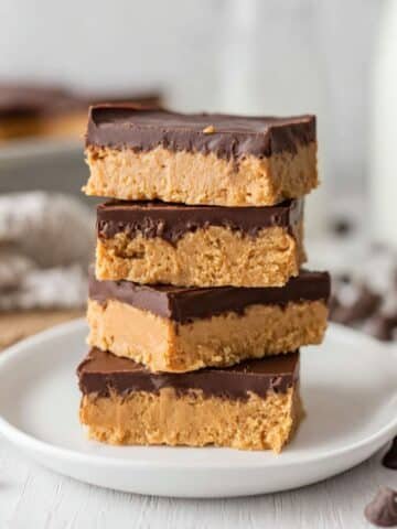Stack of homemade buckeye bars with chocolate topping