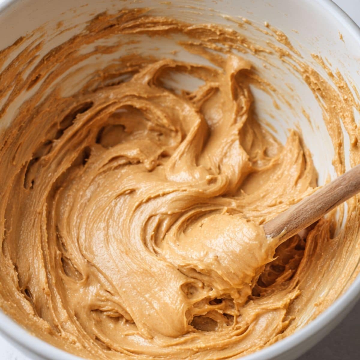Mixing peanut butter base in bowl	