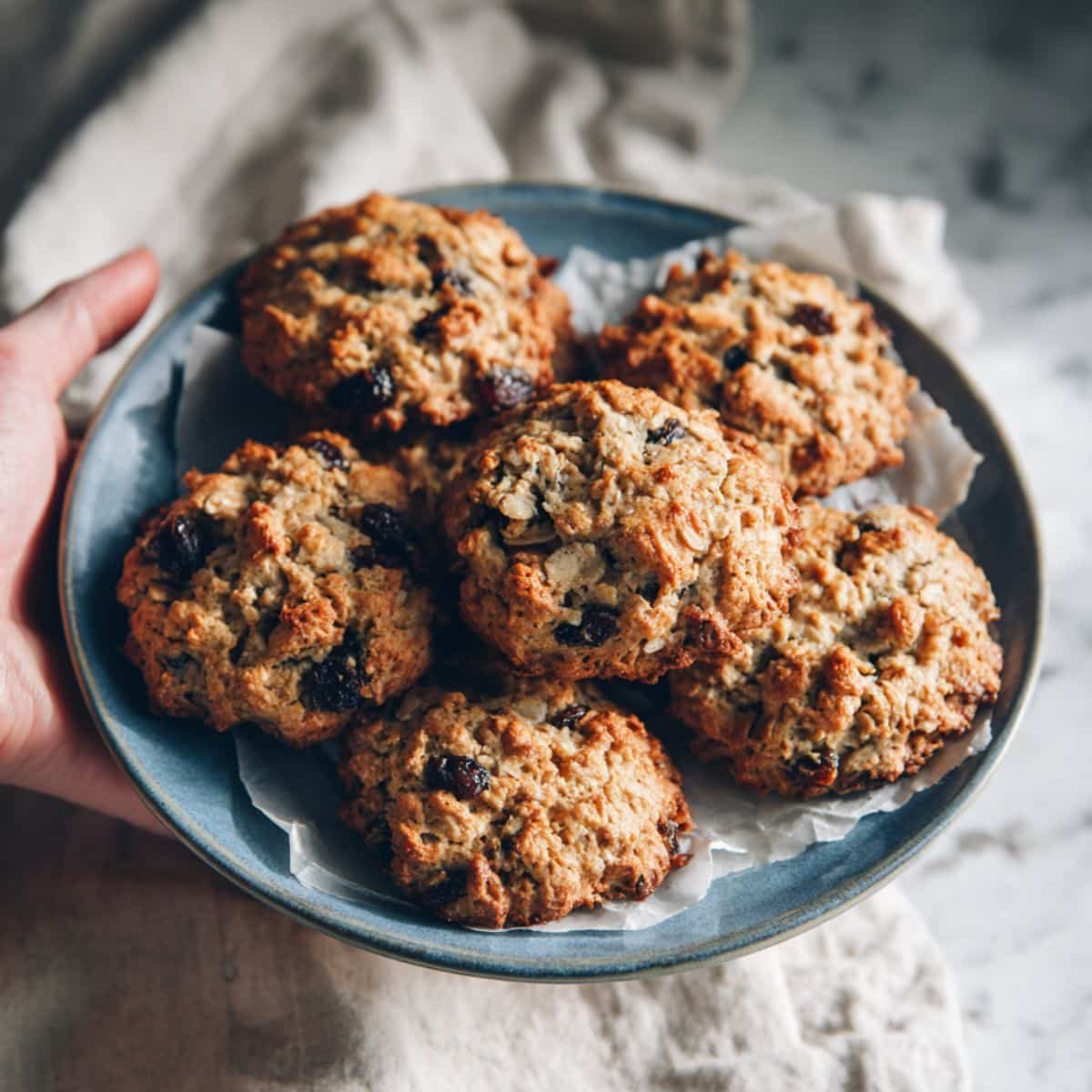 Freshly baked healthy oatmeal raisin cookies on plate