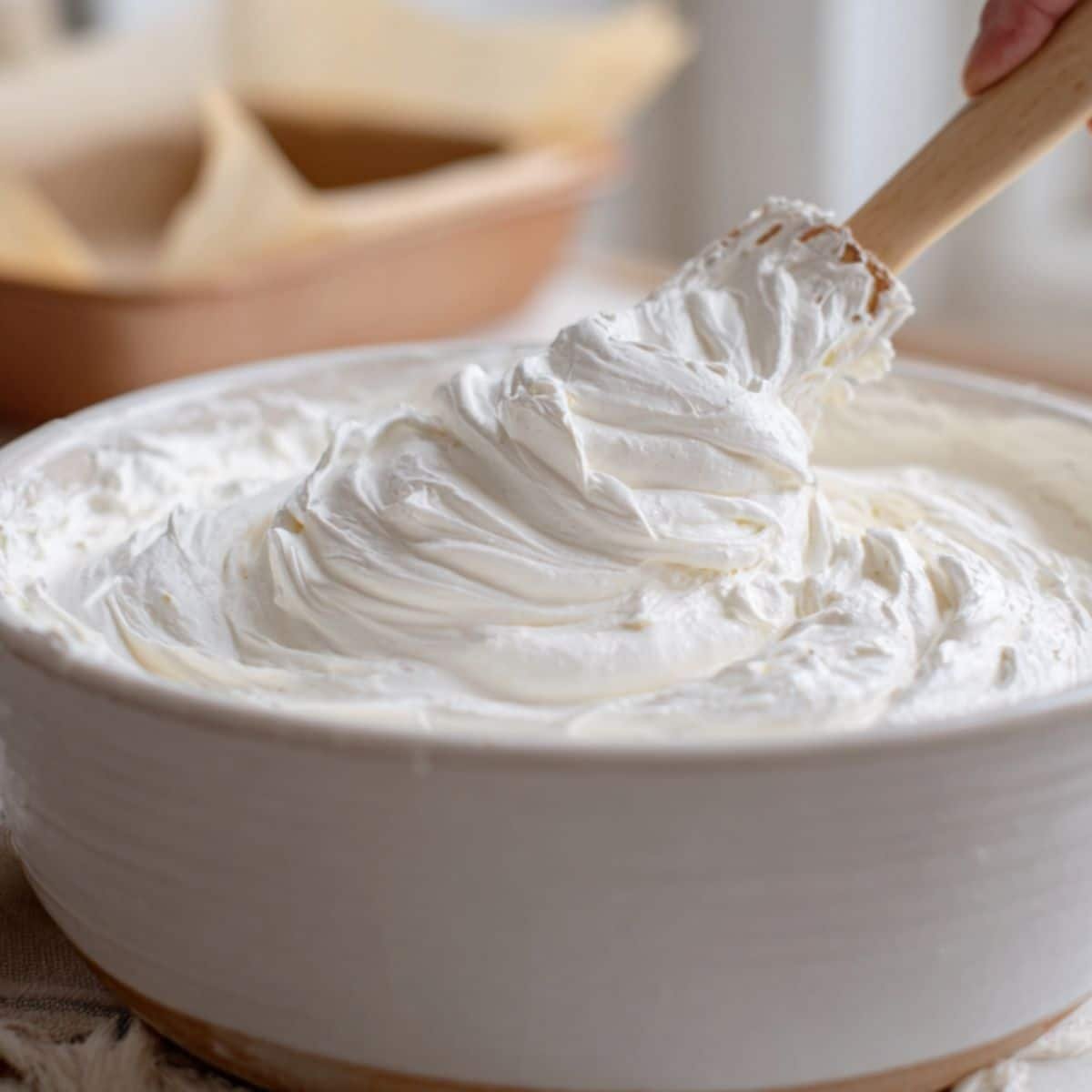 Shiny stiff peak meringue in a bowl	