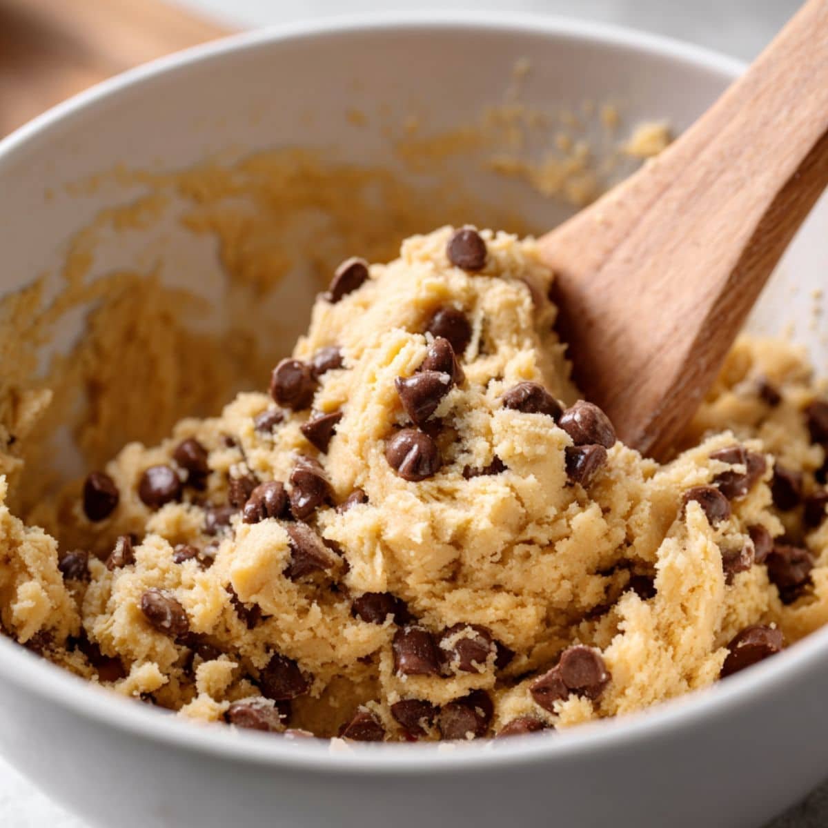 Chocolate chip cookie dough in mixing bowl	