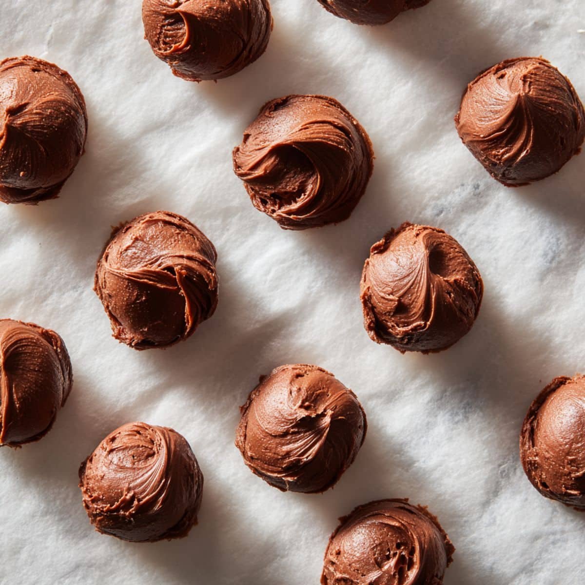 Frozen Nutella portions on parchment paper	
