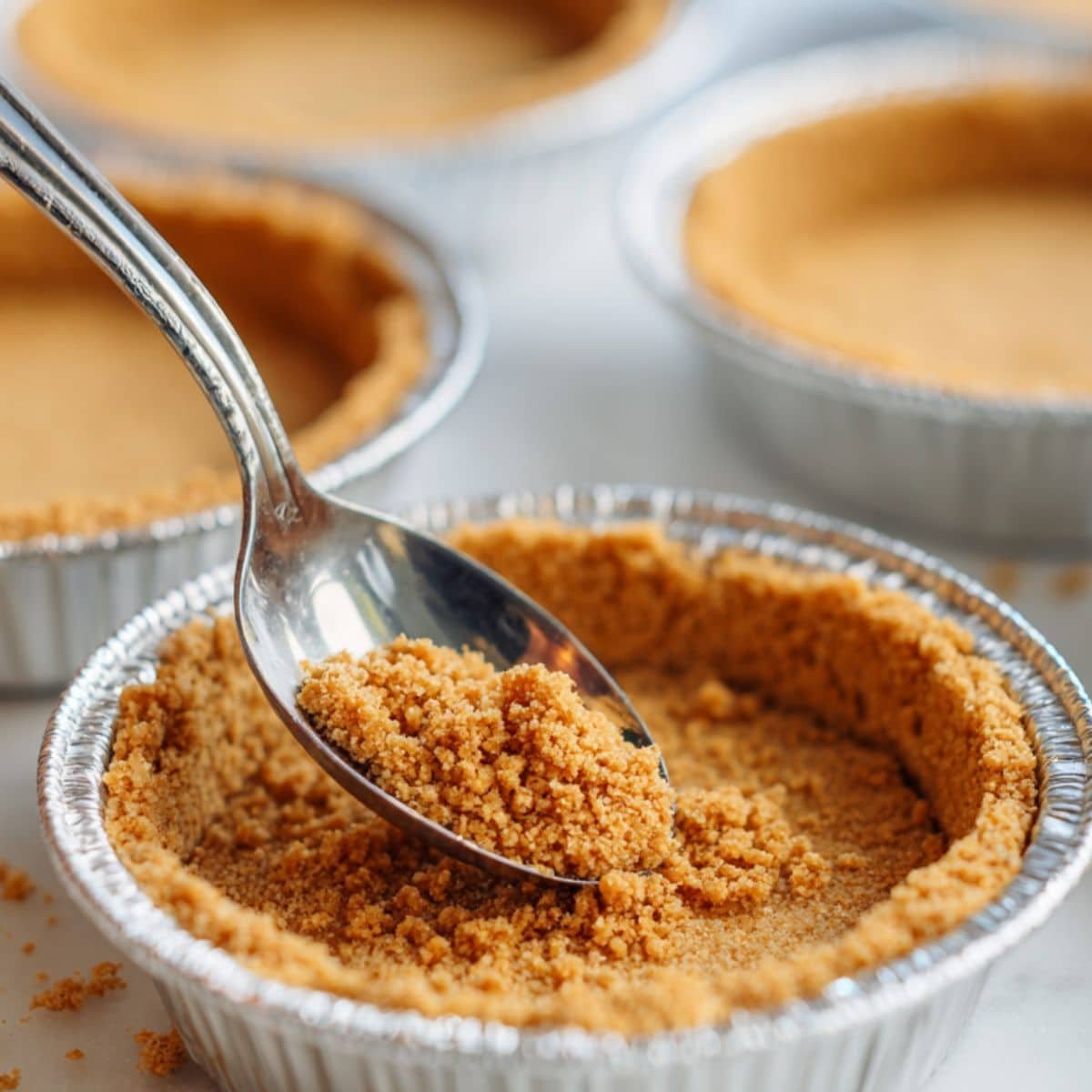 Graham cracker crust pressed into mini pie tins	