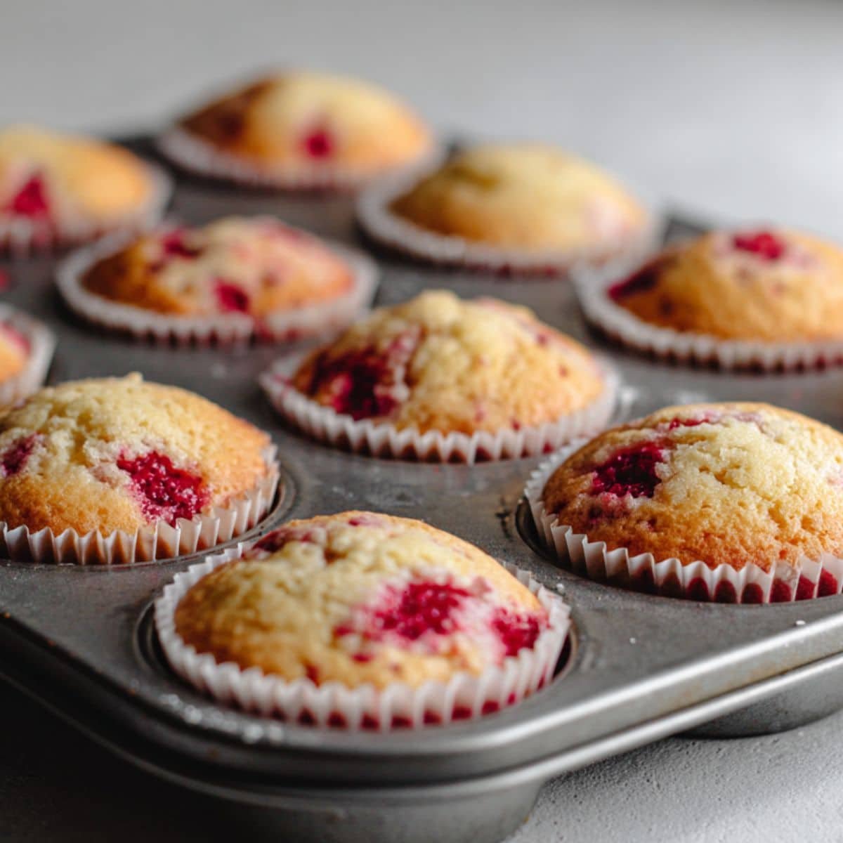 Cupcake batter in lined muffin tin ready to bake	