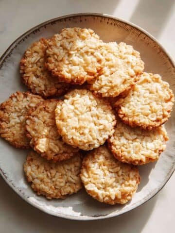 Freshly baked rice krispie cookies on a white kitchen counter