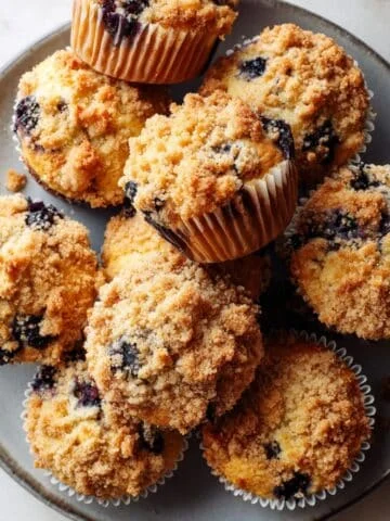 Freshly baked blueberry crumble muffins with crumb topping