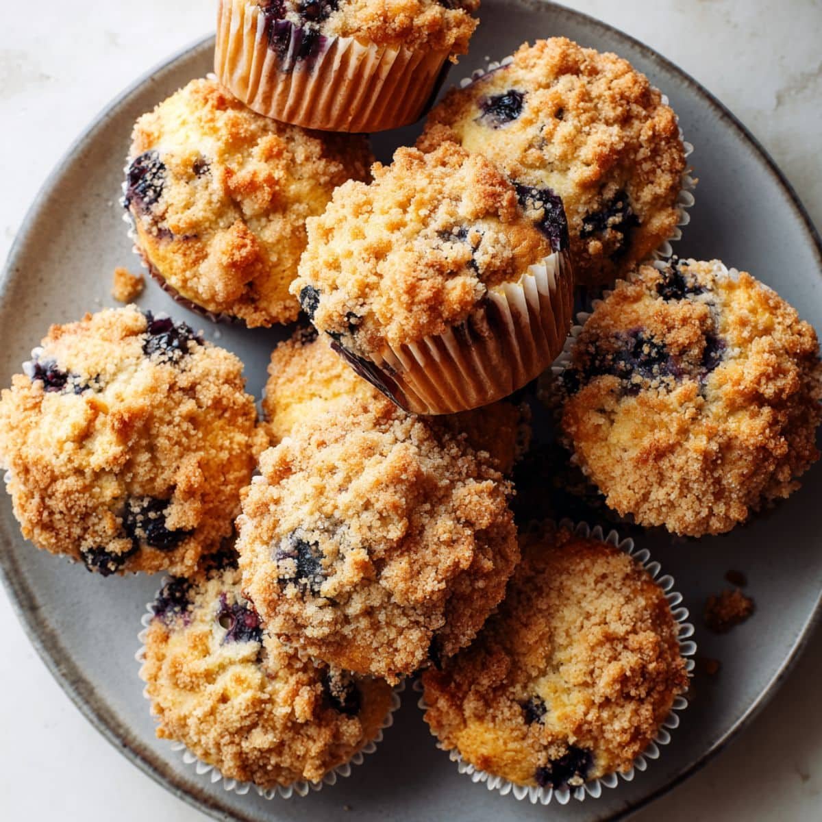 Freshly baked blueberry crumble muffins with crumb topping