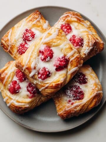 Raspberry cream cheese danish pastries with glaze