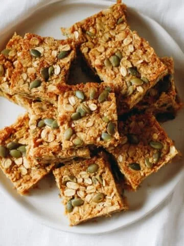 Homemade pumpkin oatmeal bars cut into rustic squares