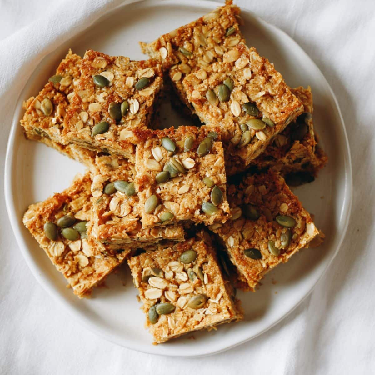Homemade pumpkin oatmeal bars cut into rustic squares