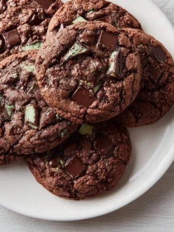 Homemade Andes mint cookies on a white kitchen table, photographed from above with a casual, natural style.