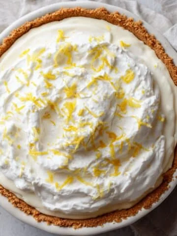 Homemade lemon pie on white kitchen counter.