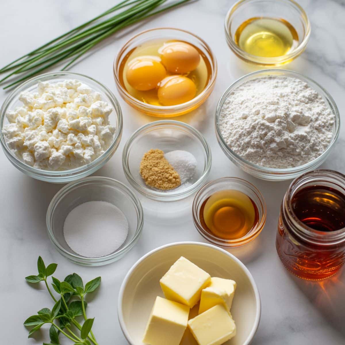 Flat lay of keto cottage cheese bread ingredients on a white kitchen counter.