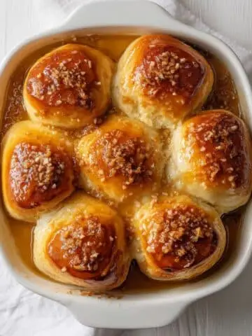 Pani Popo Samoan Coconut Buns baked in coconut milk, top-down photo.