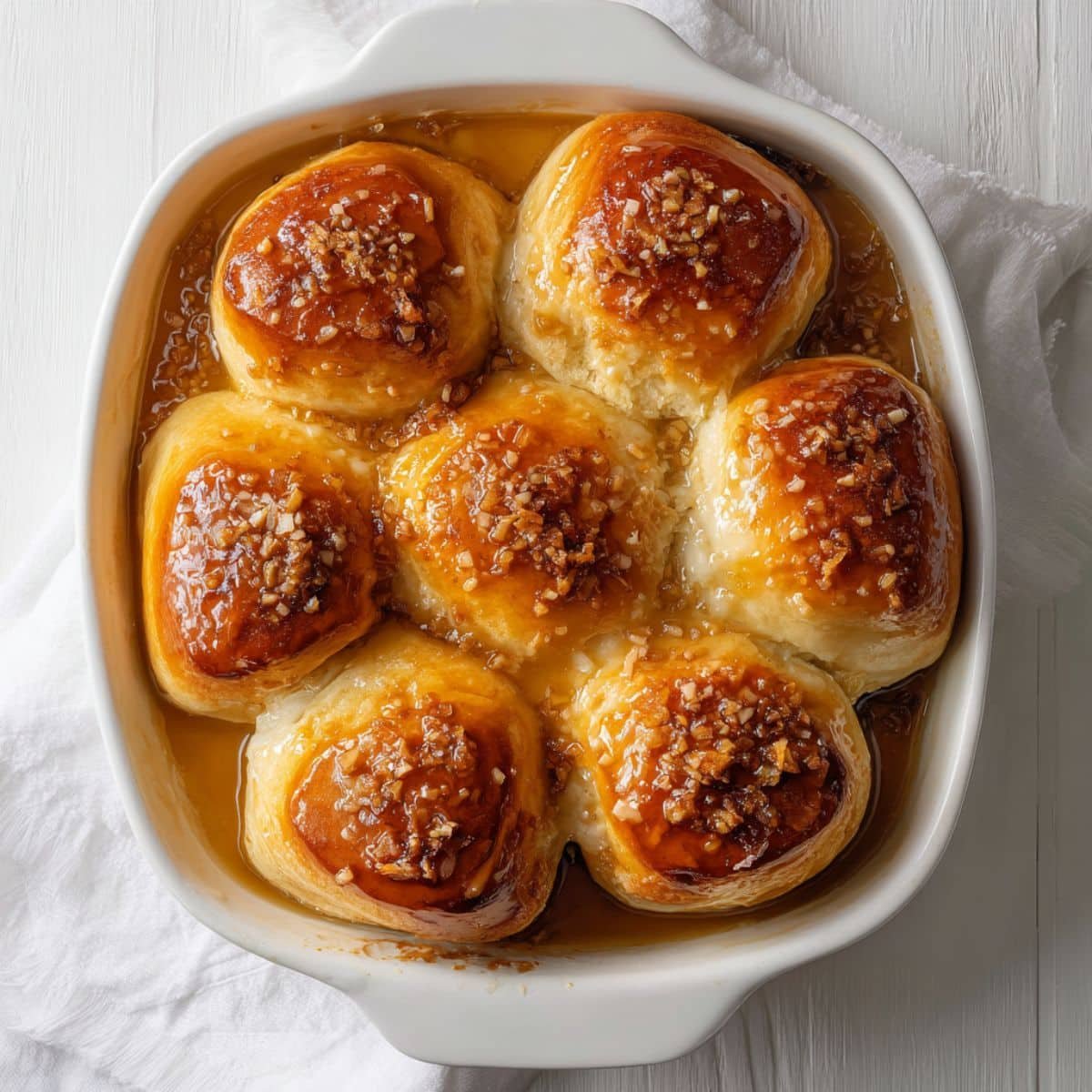 Pani Popo Samoan Coconut Buns baked in coconut milk, top-down photo.