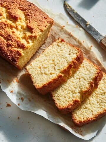 Freshly baked coconut flour keto bread loaf on parchment paper