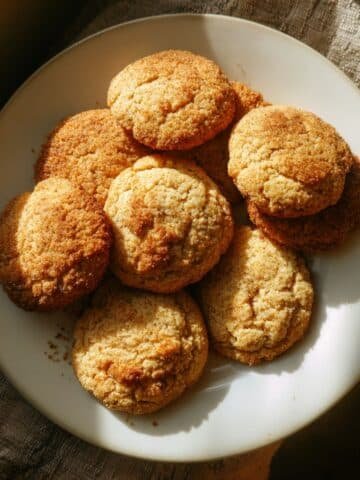 Soft homemade applesauce cookies on a white plate, shot from above.